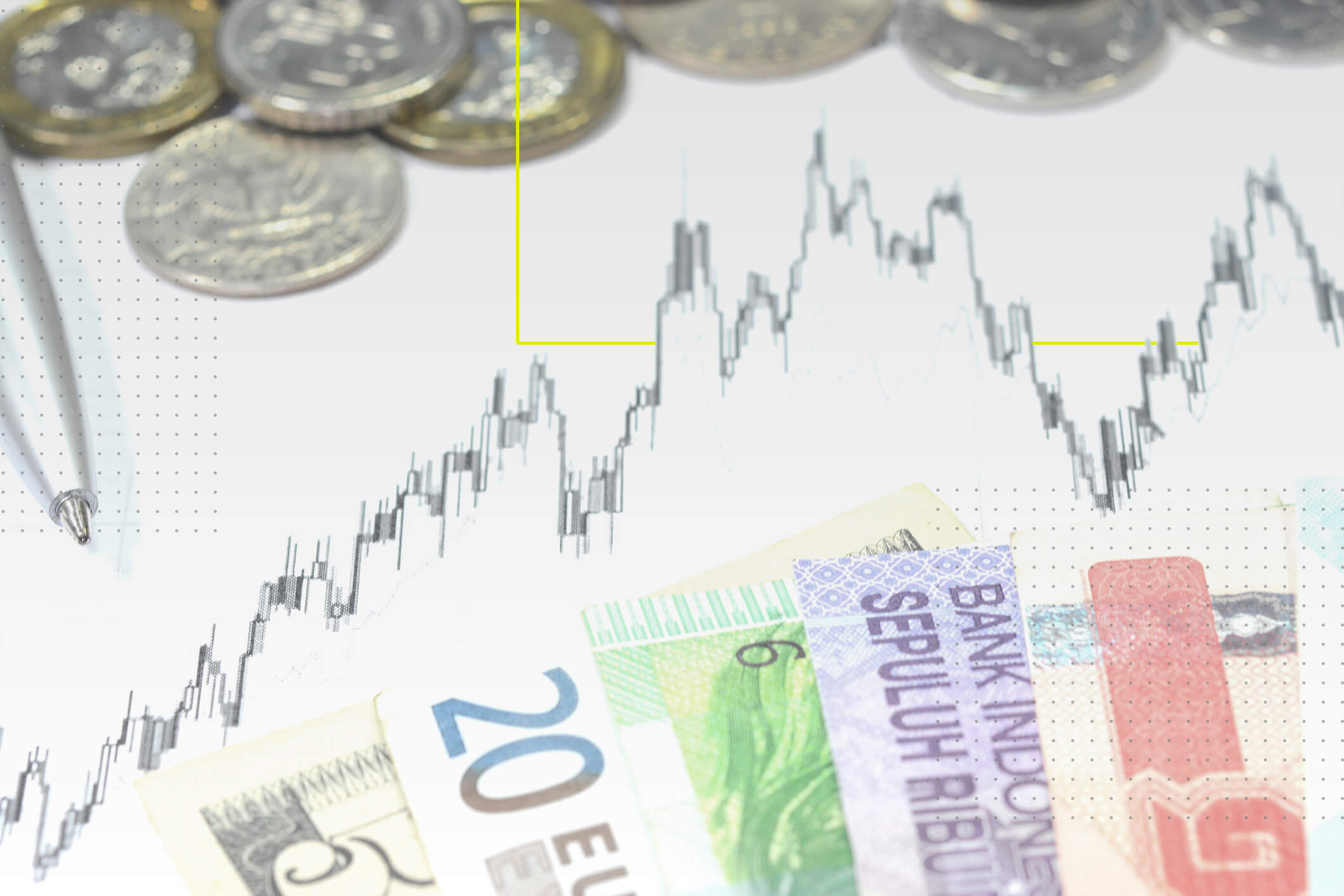 En las orillas aparecen monedas y billetes de diferentes países denominaciones. En el centro una gráfica que muestra alzas bajas. 